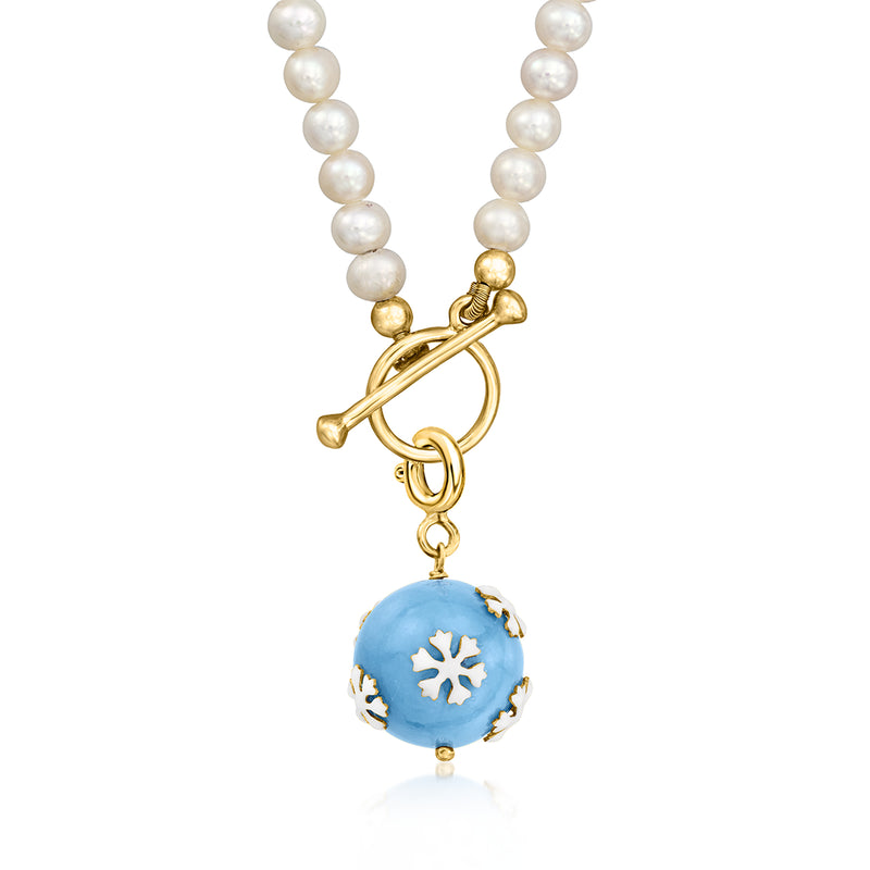 Gold-tone snowflake charm on pearl strand with blue enamel round center and white snowflakes