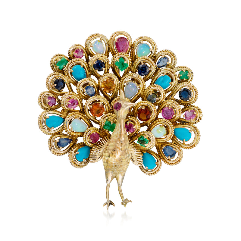 Vintage peacock pin in yellow gold with multicolor gemstone plumage
