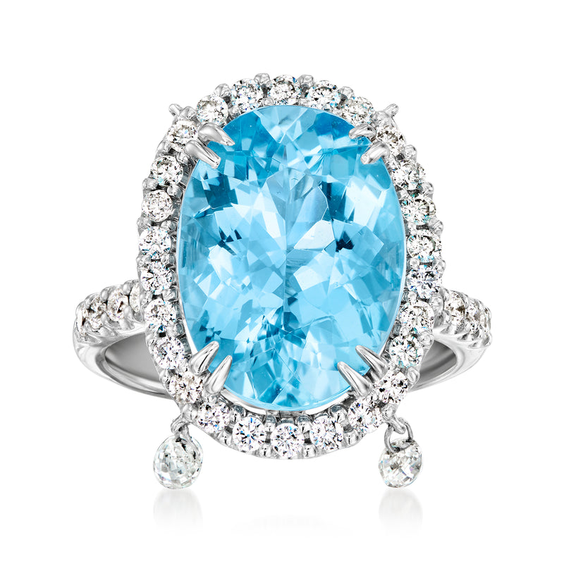 Oval Swiss blue topaz ring in 18kt white gold with diamond halo and prong-set stones