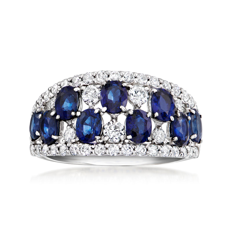 Platinum vintage ring with oval blue sapphires and round white diamonds across the band