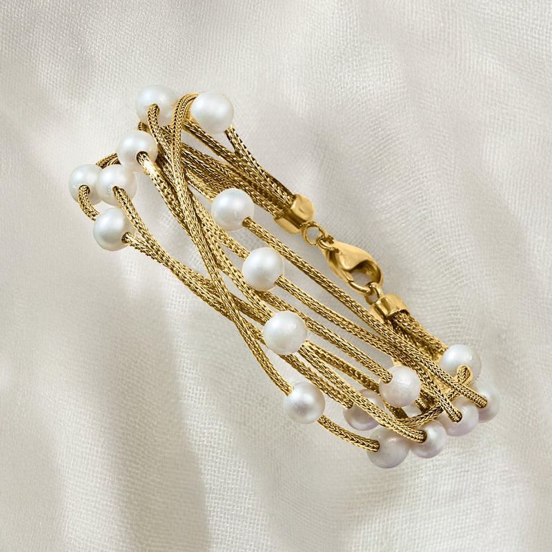 Gold multi-row pearl bracelet with stacked rope links and visible clasp hardware