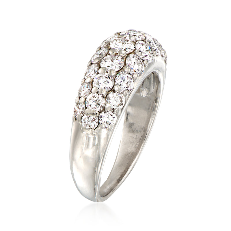 Platinum three-row diamond ring with pavé-set stones and a domed band