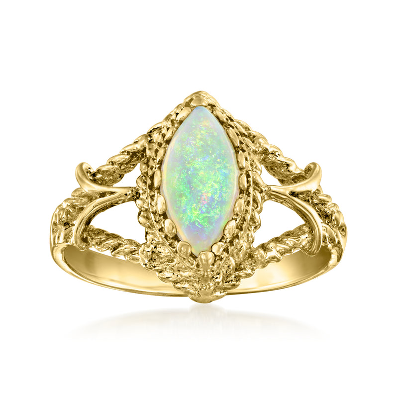 18kt yellow gold opal ring with oval cabochon and ornate filigree setting