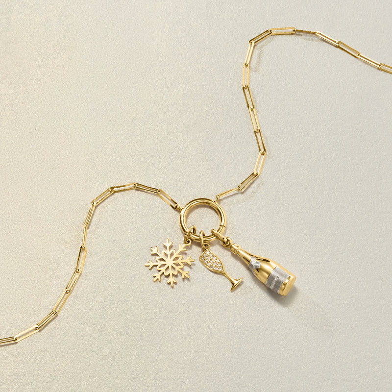 14kt yellow gold champagne flute charm with diamond accents and snowflake charm