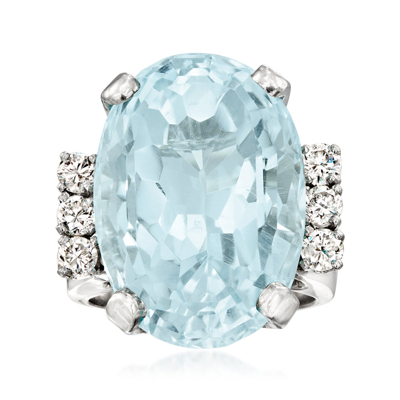 Sky blue topaz oval cocktail ring, 14kt white gold with diamond side stones