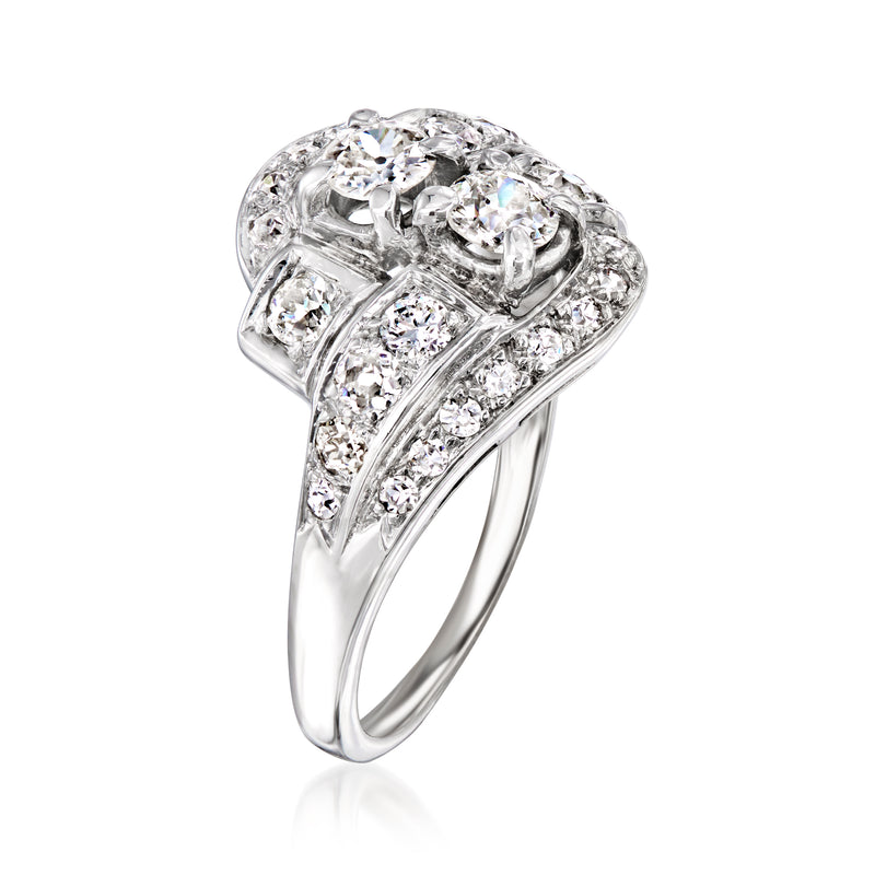 Vintage white gold diamond ring with three round stones and pavé-set band