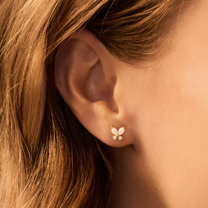Yellow gold opal butterfly stud with three small round clear stones