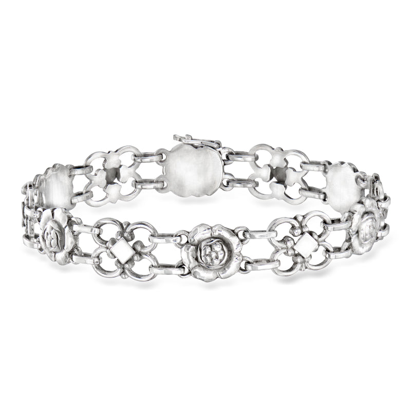 Vintage sterling silver flower-link bracelet with ornate round medallion clasp