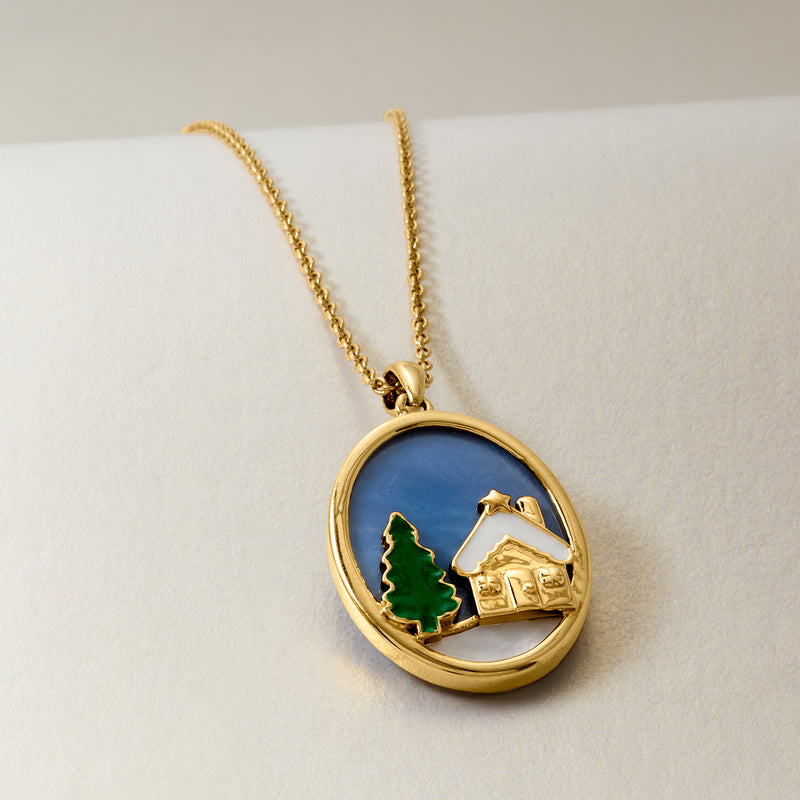 Gold-tone oval pendant necklace with blue enamel, green tree, white house, star charm