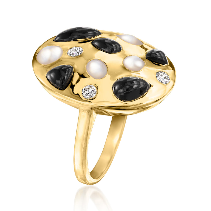 Gold tone onyx and mother-of-pearl ring with inset round stones, angled side view
