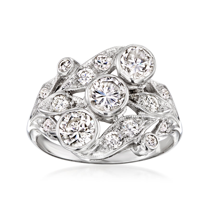 Vintage 14kt white gold diamond ring with round stones in a curved halo setting