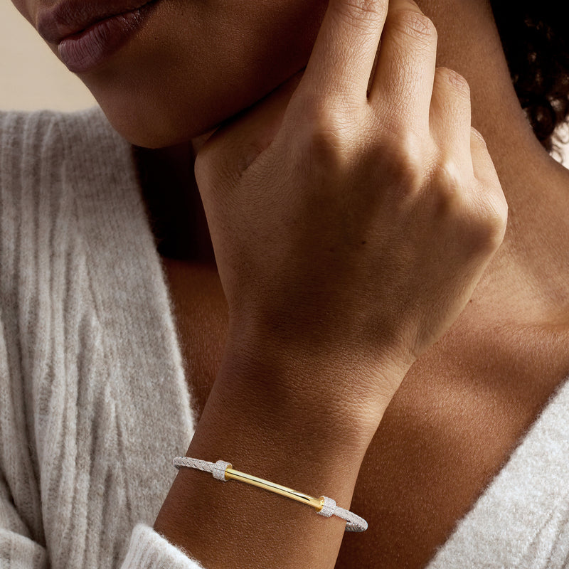 CZ bar cuff bracelet in sterling silver and gold on wrist