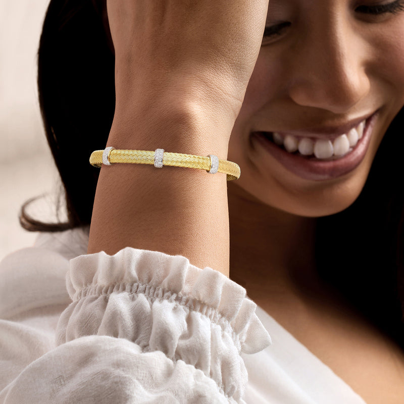 Wrist-worn CZ station cuff bracelet with woven gold over sterling and small clear stones