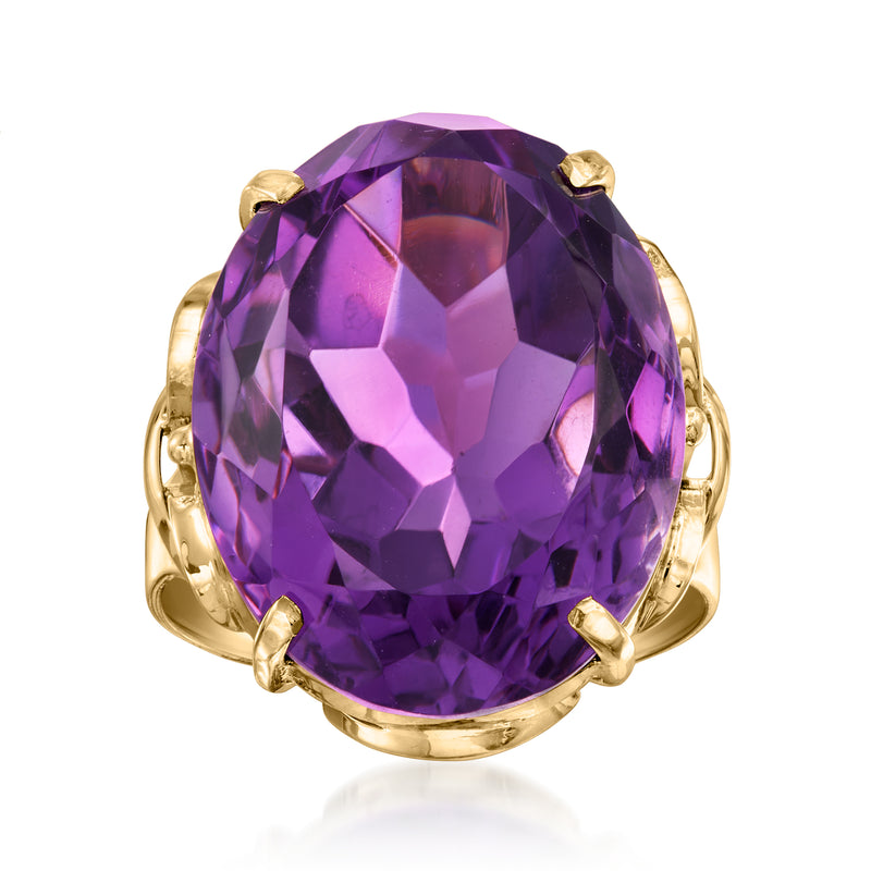 Vintage amethyst ring in 14kt yellow gold with large oval purple gemstone and four prongs