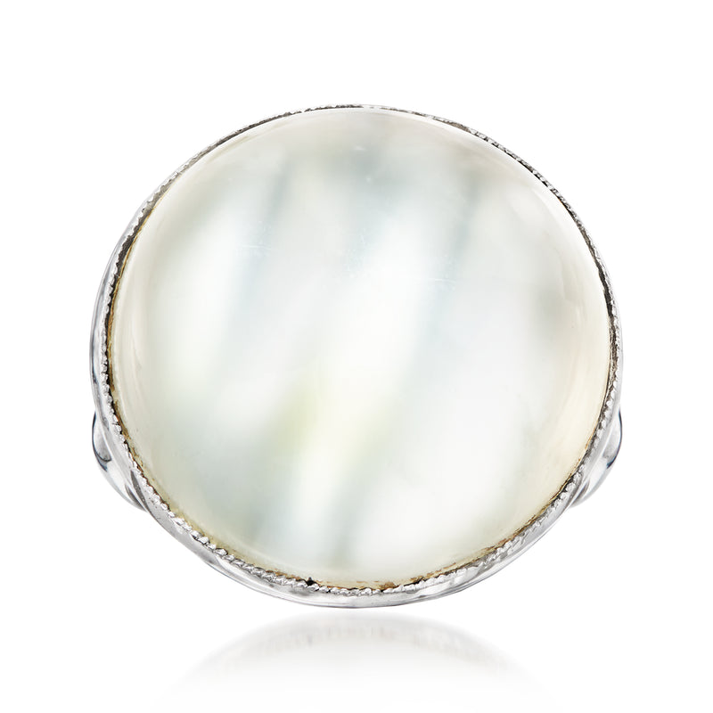 Vintage moonstone ring in 14kt white gold with oval cabochon and halo setting