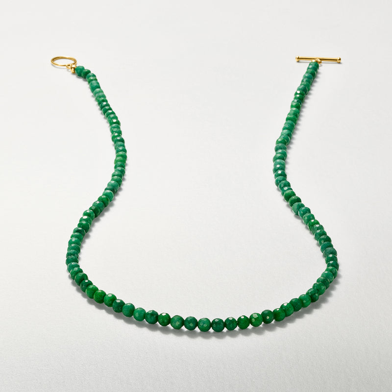 Green bead toggle necklace shown flat, gold clasp ends visible