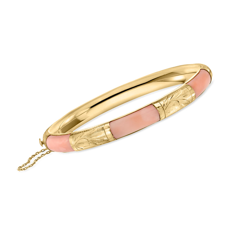 Vintage pink coral bangle bracelet in 14kt yellow gold with hinged clasp