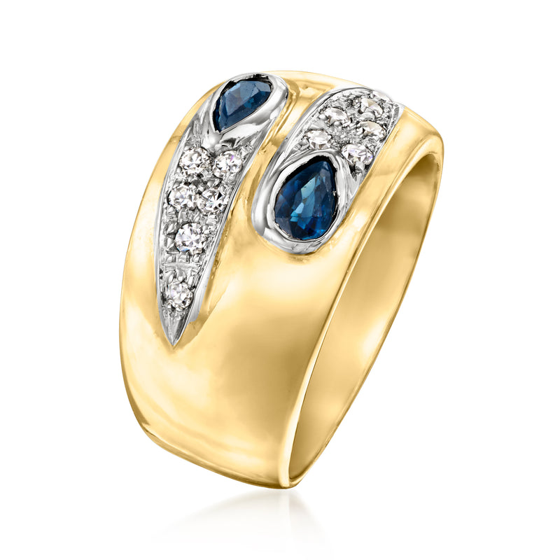 Side view of 18kt yellow gold ring with two blue sapphire oval settings and diamond accents
