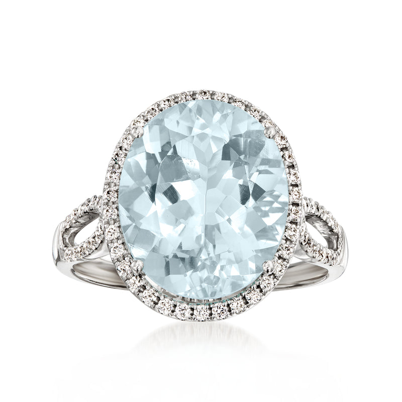 Oval aquamarine gemstone ring with diamond halo and split prong white gold band