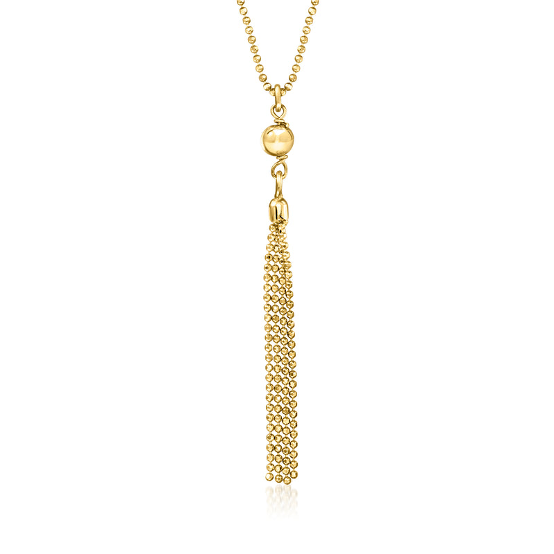 Gold-tone bead tassel necklace with round charm and long dangling chain tassel