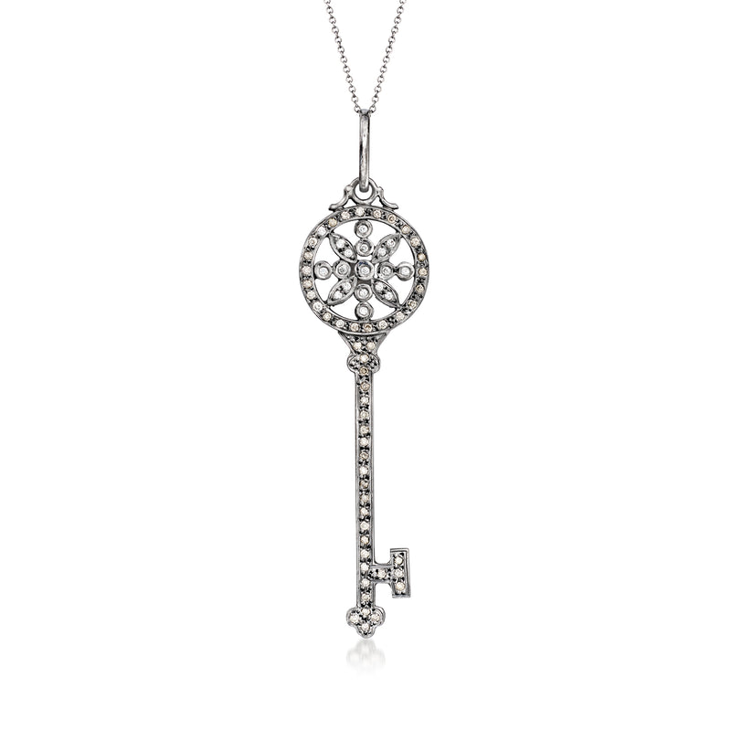 Diamond key pendant necklace in 14kt white gold, circular top and long key dangle