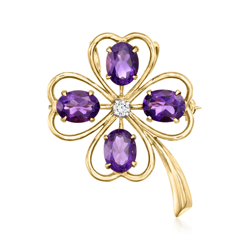 Vintage 14kt yellow gold clover pin with oval amethyst stones and small diamond center.