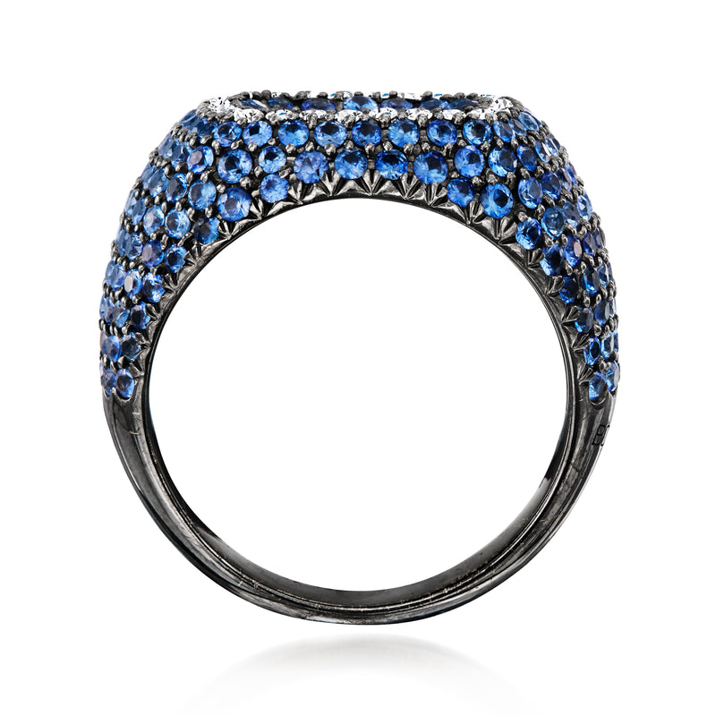 Sapphire and diamond ring side view with blue stone setting on white gold band