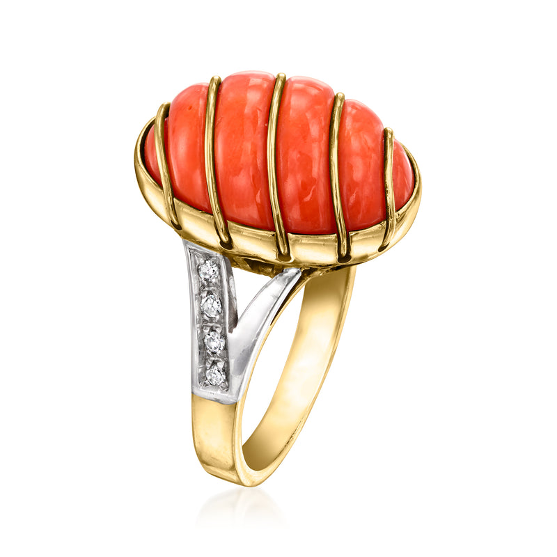 Coral-red segmented oval ring with gold bezel and diamond-set shoulders