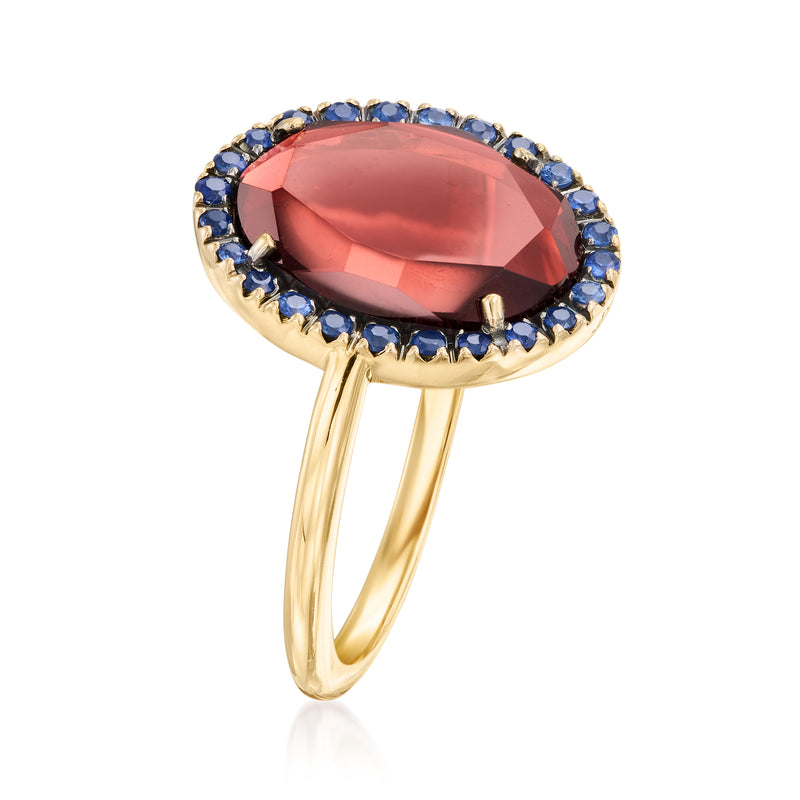 Oval red gemstone with blue sapphire halo ring, 18kt yellow gold band