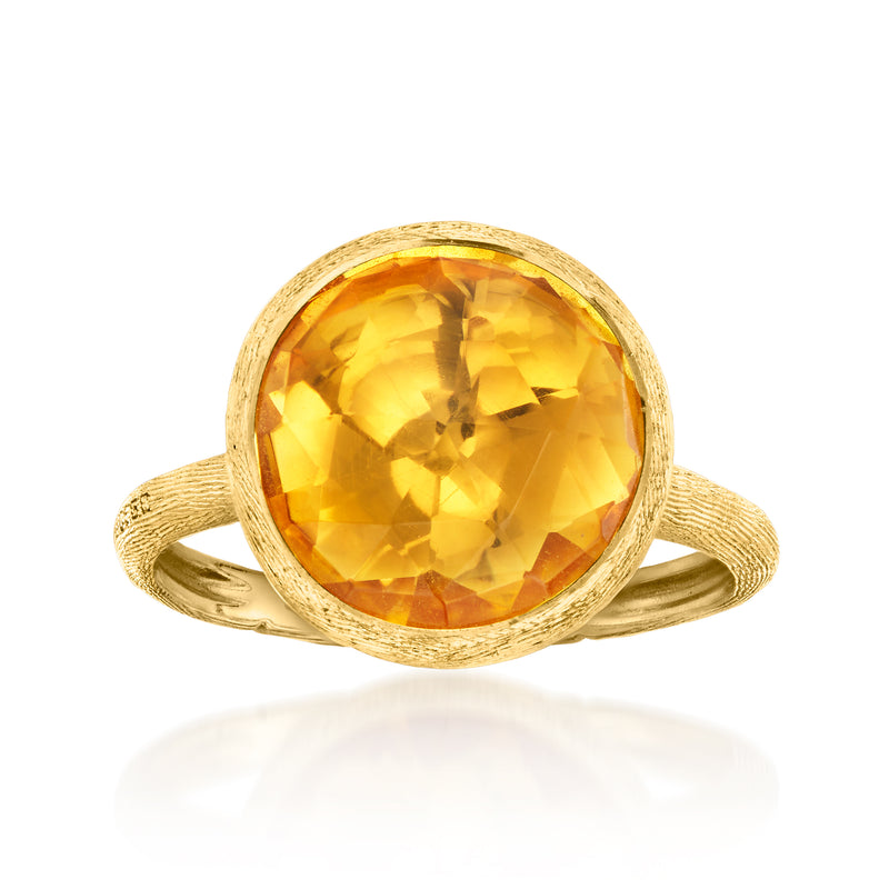 Vintage 18kt yellow gold citrine ring with round faceted gemstone, textured halo