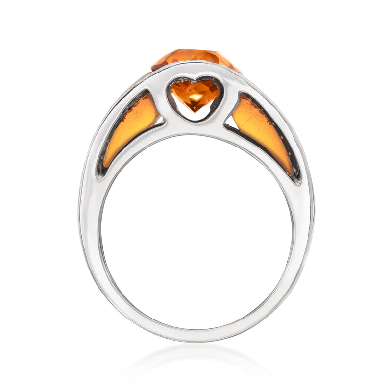 White gold ring top view with heart-shaped orange gemstone centerpiece and cutout sides