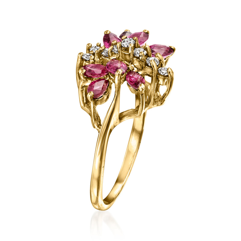 Yellow gold butterfly ring with pink oval gemstones and small clear diamond clusters