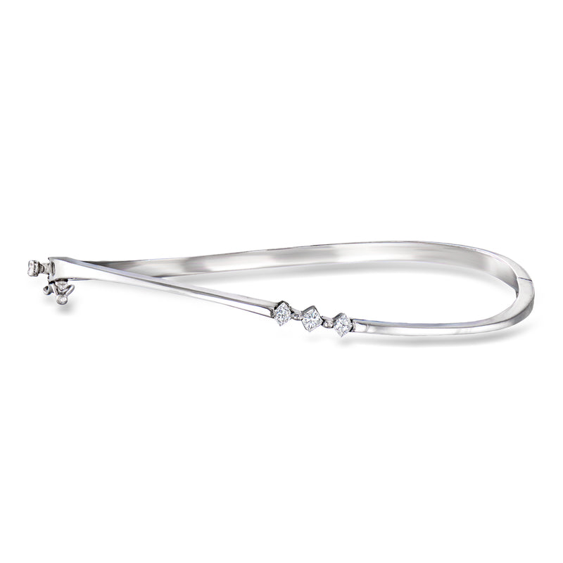 14kt white gold diamond bangle bracelet with three small round stones