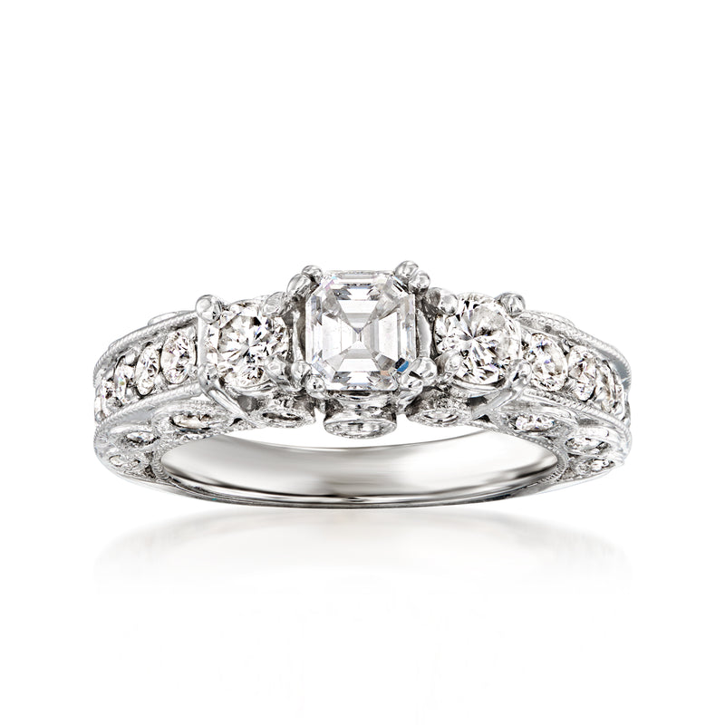 Vintage diamond ring in white gold with center emerald-cut stone and side round diamonds