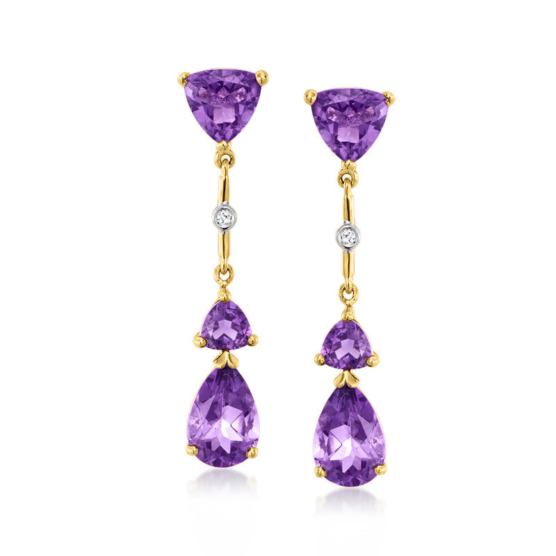 Amethyst drop earrings in 14kt yellow gold with three faceted purple stones and diamond accents
