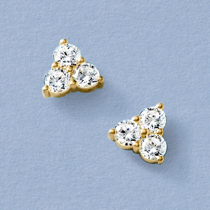 Three-stone CZ stud earrings with gold posts and three round clear stones per ear