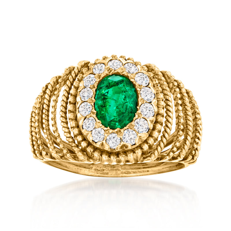 Vintage oval emerald and diamond halo ring in 18k yellow gold.