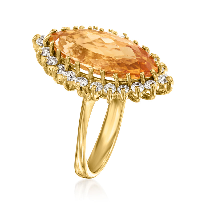 Yellow gold ring with oval orange topaz in pave diamond setting, side view
