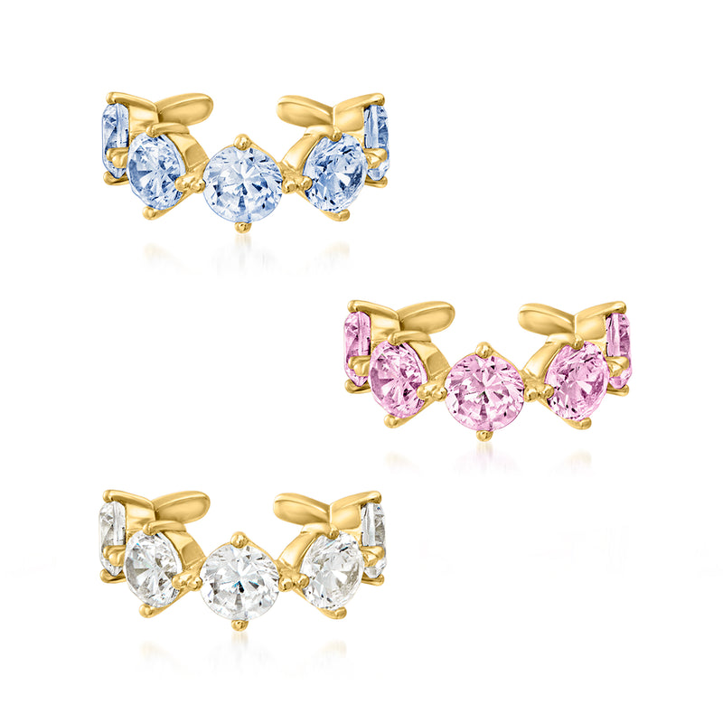 Gold-tone three ear cuffs with light blue simulated gemstones and bow-like settings