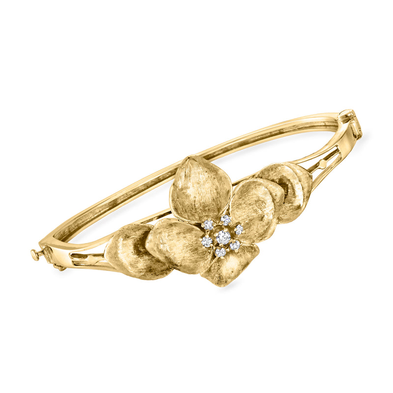 Vintage 14kt yellow gold bangle bracelet with diamond flower clasp