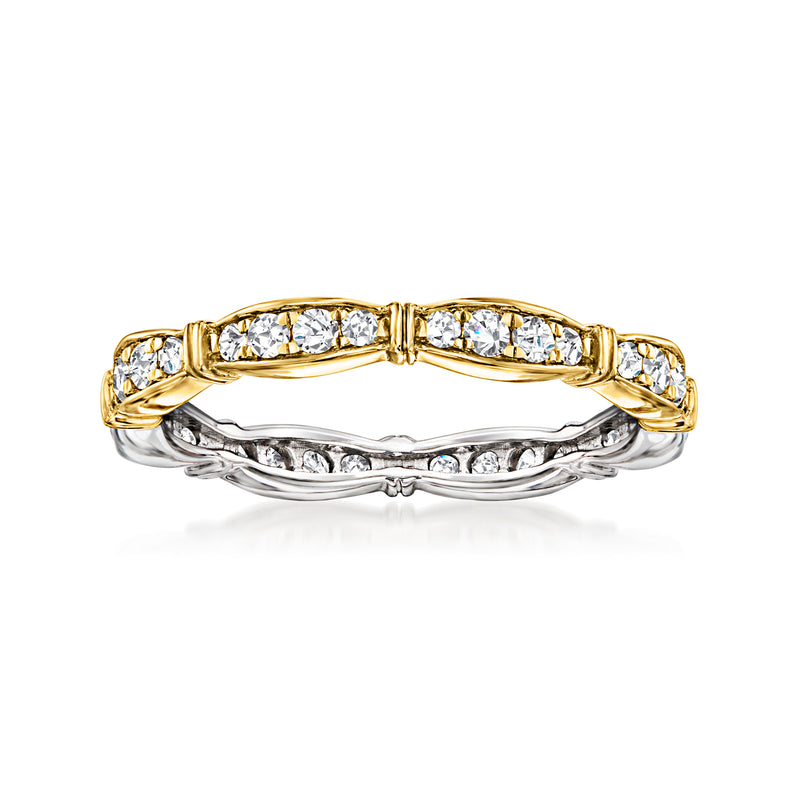 Two-tone diamond ring with gold upper band and sterling silver underlayer, prong-set stones