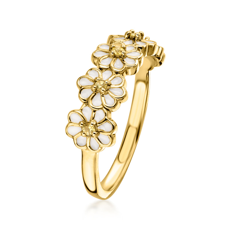 Gold openwork flower ring with white enamel petals and yellow stones, curved band.