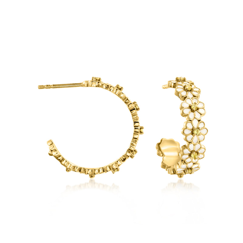 Gold hoop earrings with white enamel flower charms and small yellow gemstone accents