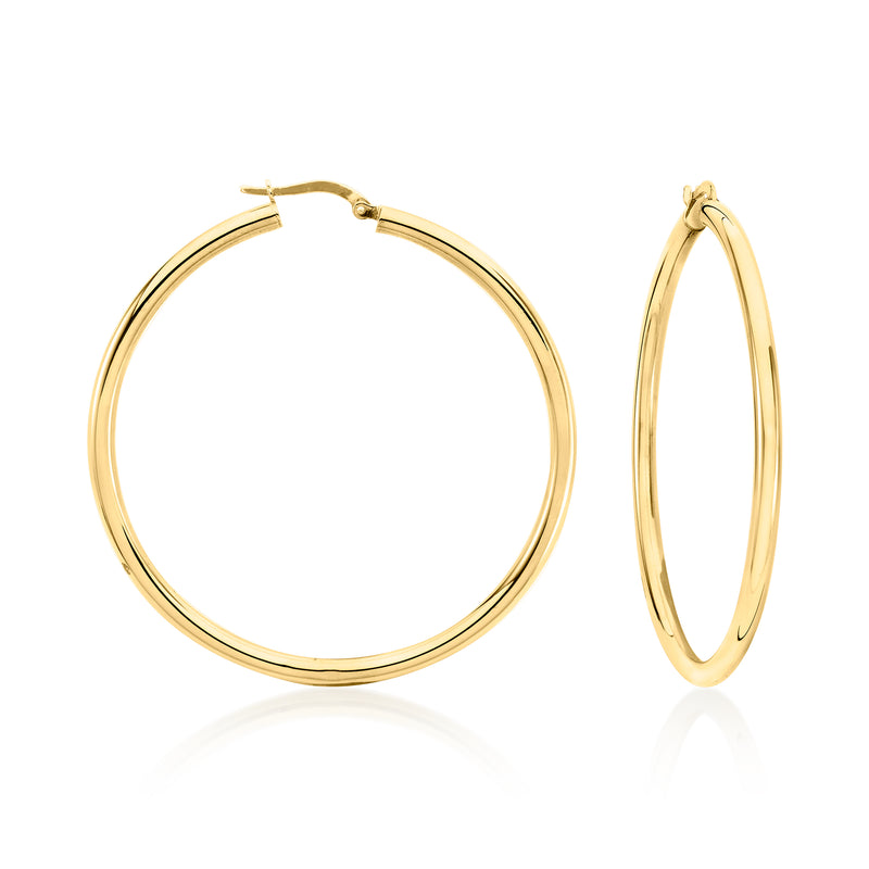 18kt yellow gold hoop earrings with oval profile and secure clasp