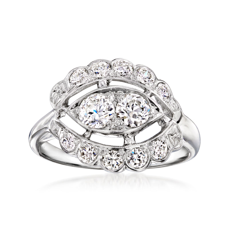 Oval diamond openwork ring in 14kt white gold with round halo stones