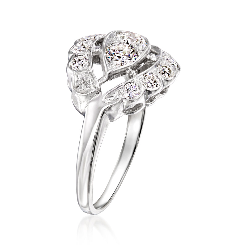 14kt white gold openwork ring with oval center stone and surrounding rounds