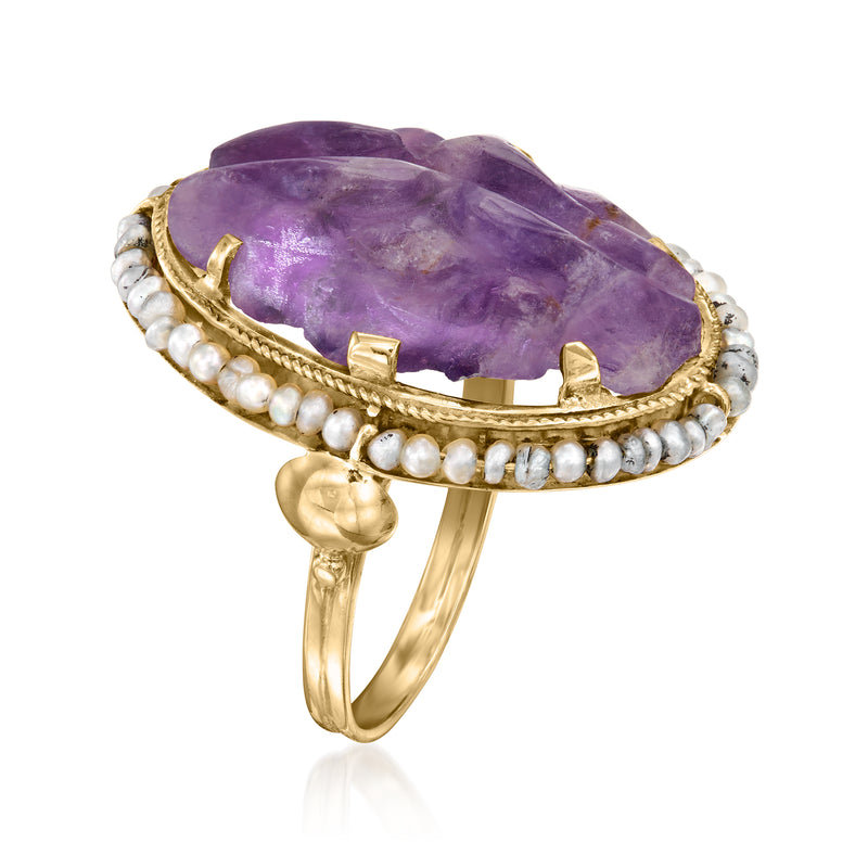 Yellow gold ring with oval purple amethyst top, pearl surround, and split band