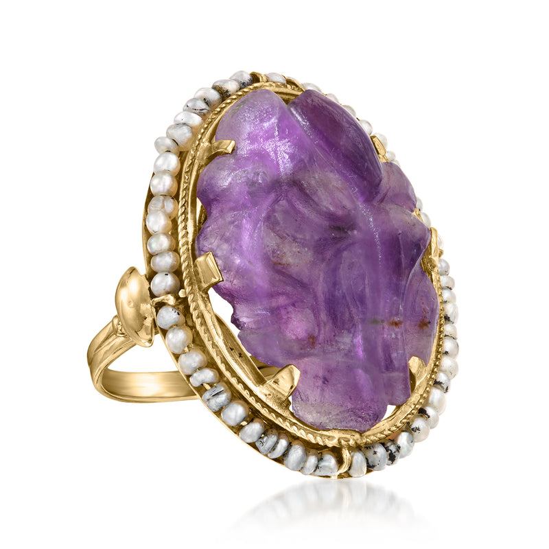 Oval amethyst cabochon ring with carved purple stone, yellow gold border, pearl accents