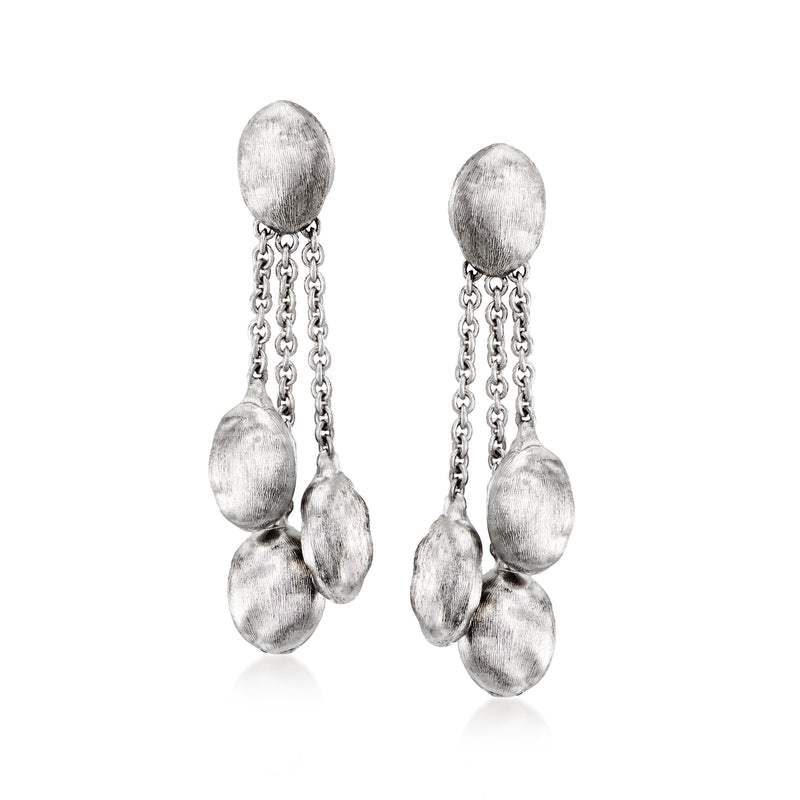 Vintage white gold drop earrings with textured oval drops and linked chain.