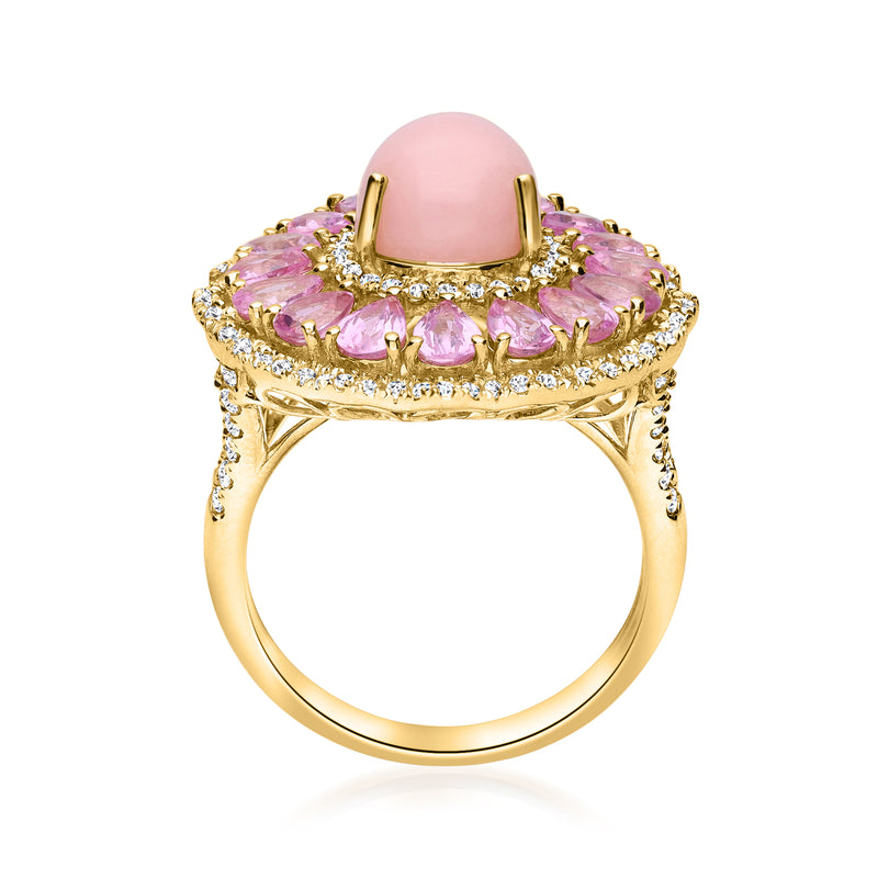 Yellow gold ring with oval pink gemstone bezel, pink sapphires, and diamond halo
